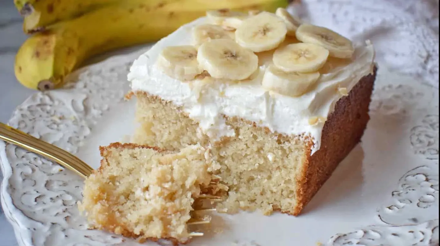 A perfectly baked best banana cake with a creamy frosting.