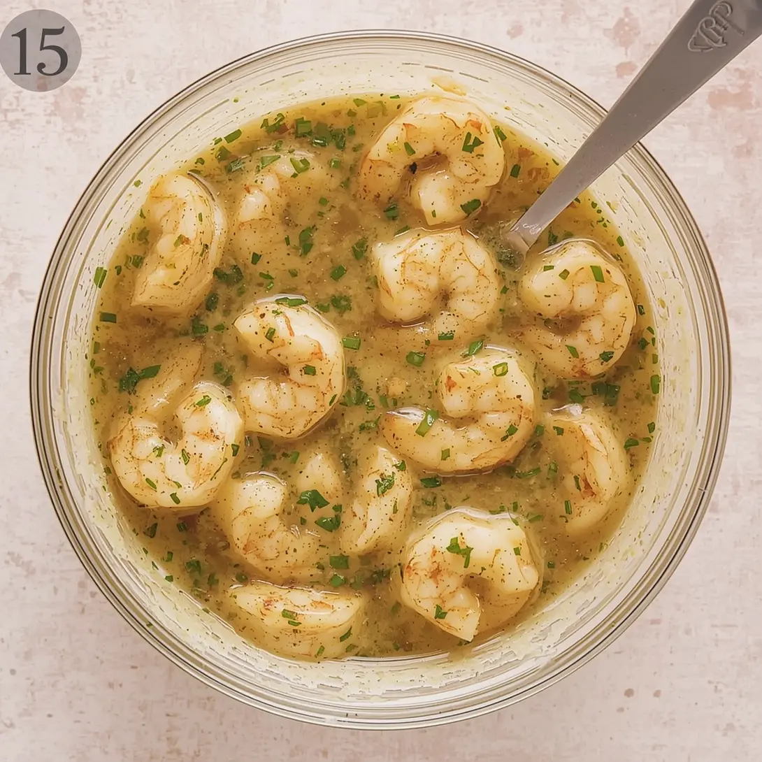 Garlic butter shrimp and cornbread dressing served in a baking dish.