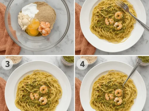 A close-up of pesto shrimp spaghetti with cherry tomatoes and fresh basil leaves.