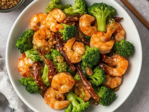 A vibrant plate of shrimp stir-fry with crisp broccoli florets.