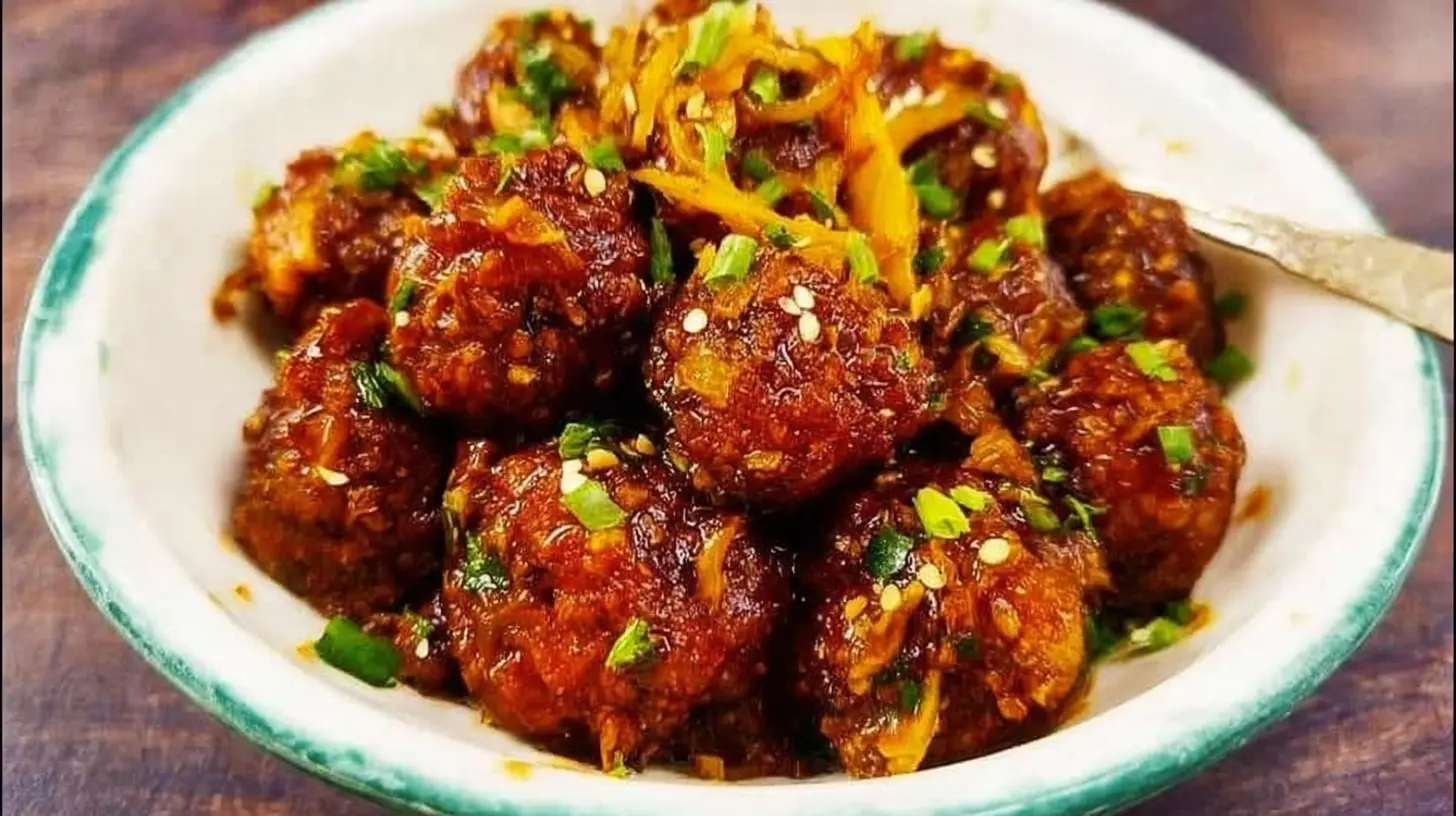 A close-up of delicious Cabbage Manchurian garnished with spring onions