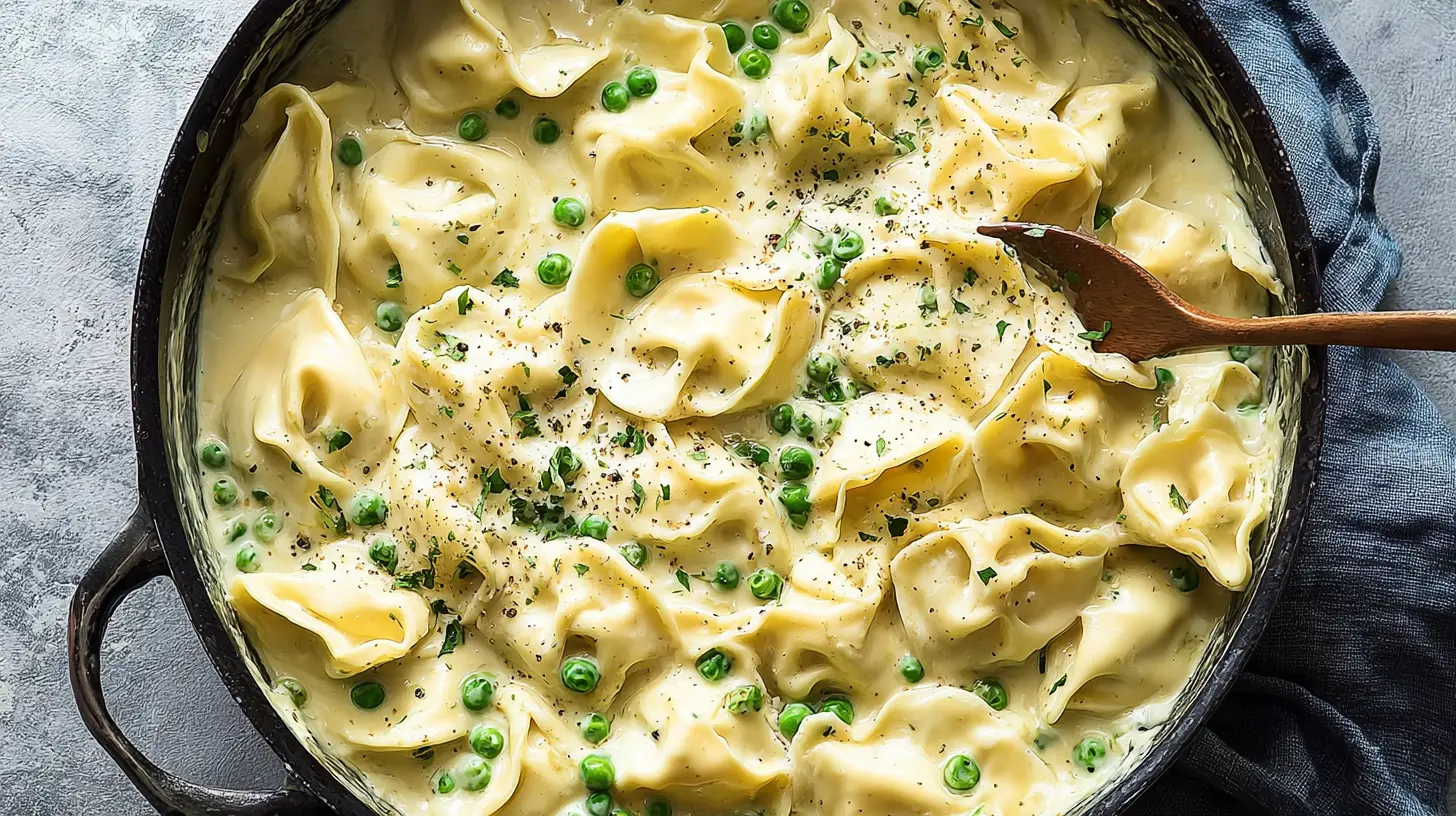 Pesto tortellini with cherry tomatoes and spinach in a bowl, ready in 15 minutes