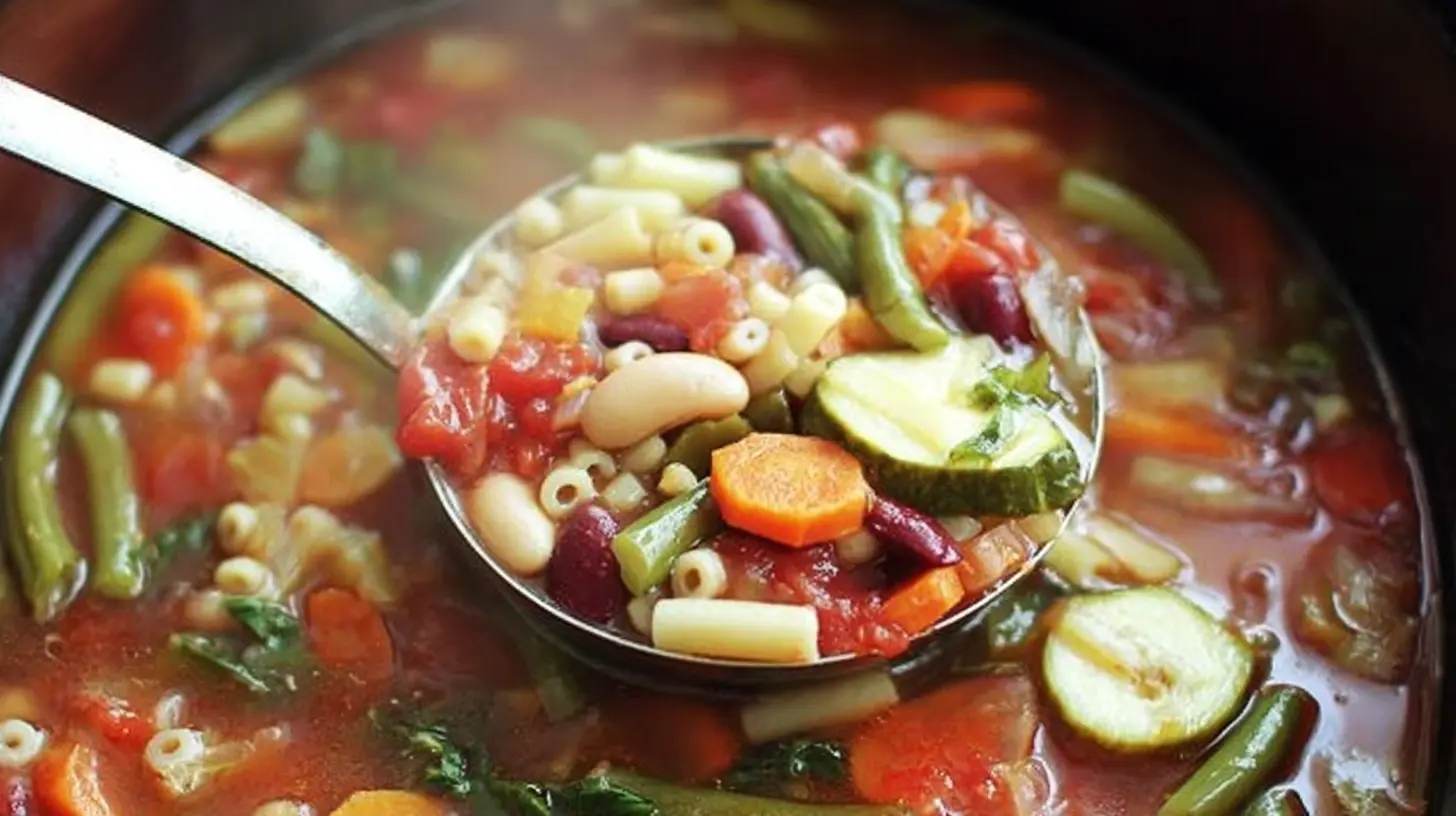 A steaming bowl of Crockpot Minestrone Soup with fresh herbs