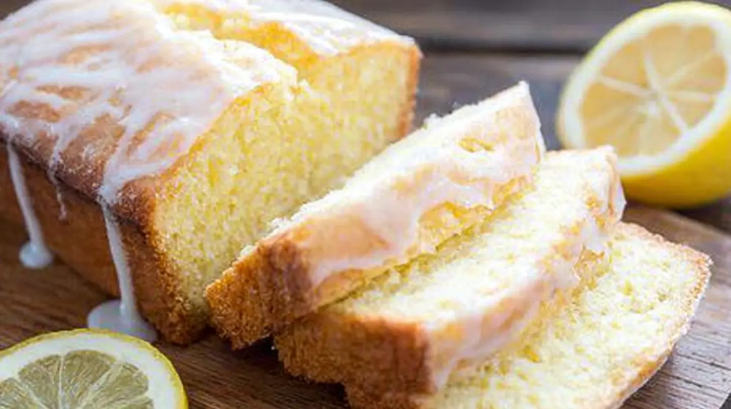A delicious lemon loaf cake, freshly baked and ready to slice.