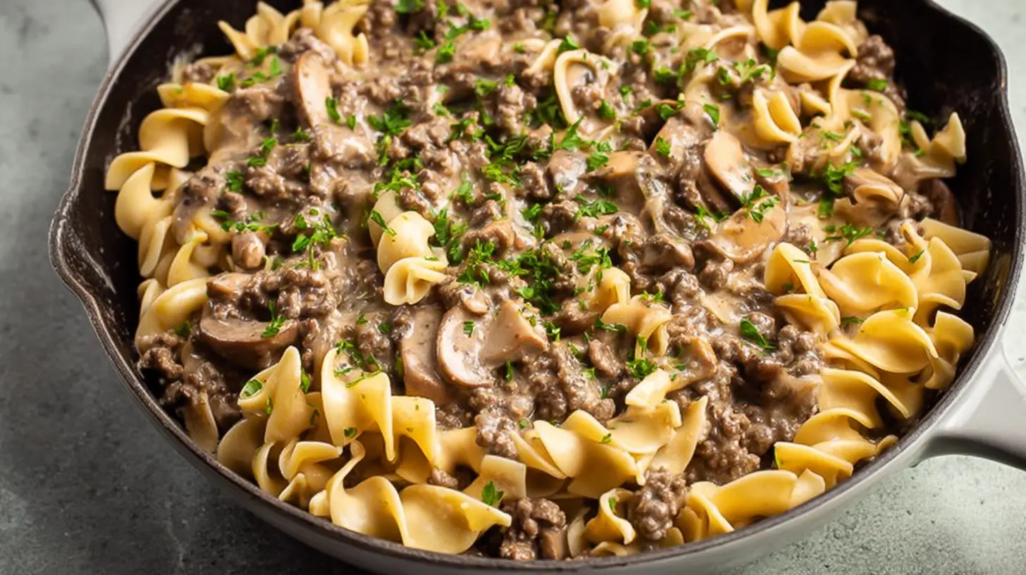 A steaming bowl of simple ground beef stroganoff with noodles.