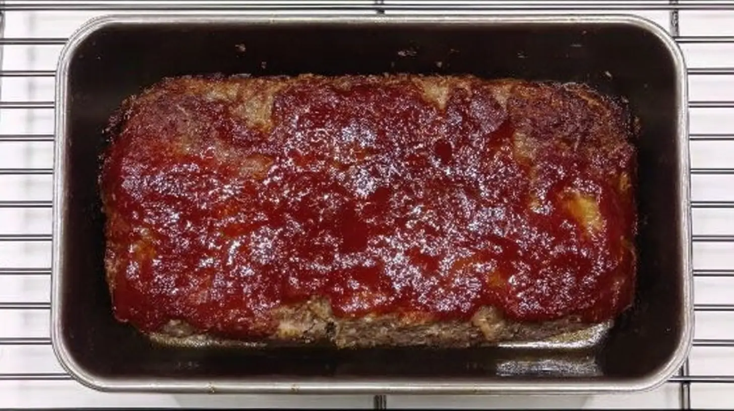 A full low-carb meatloaf dinner, perfectly cooked and sliced, ready to serve.