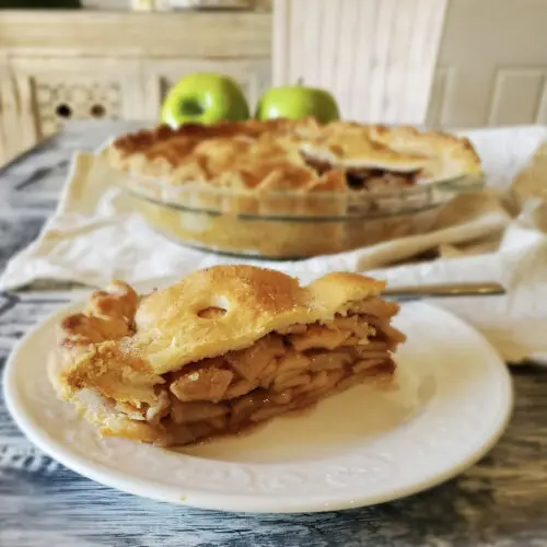 A freshly baked apple pie, a true American classic, on a wooden surface.