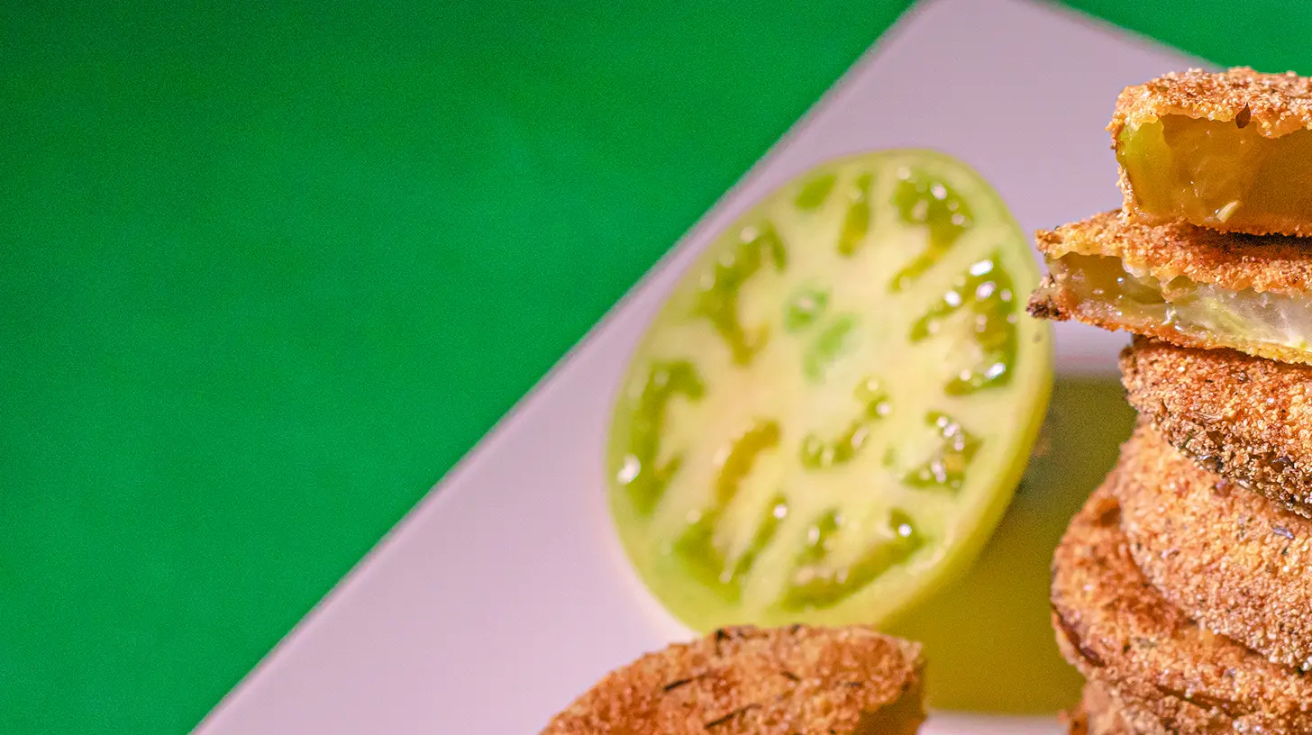 A close-up of perfectly crispy fried green tomatoes