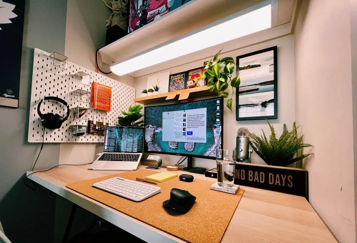A clean and organized student desk setup with a laptop and books.